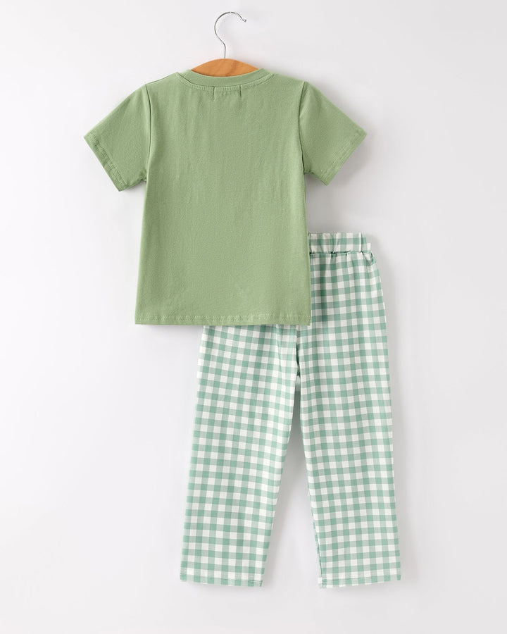 Green short-sleeve top and green plaid pants, back view