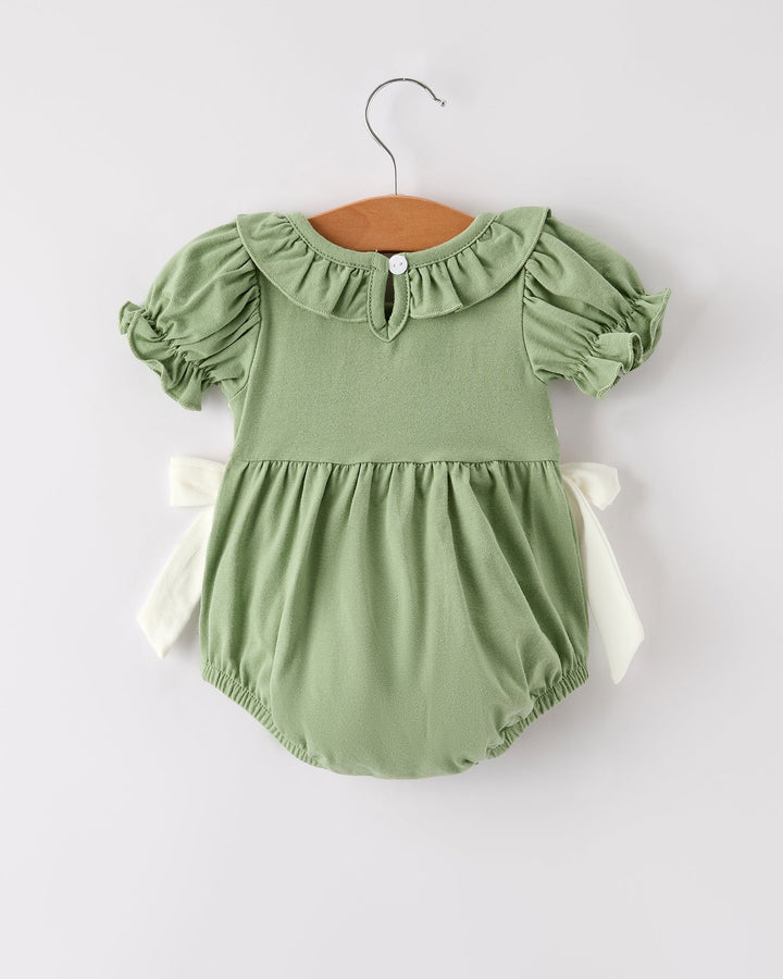 Green smocked romper with puff sleeves and ruffled neckline