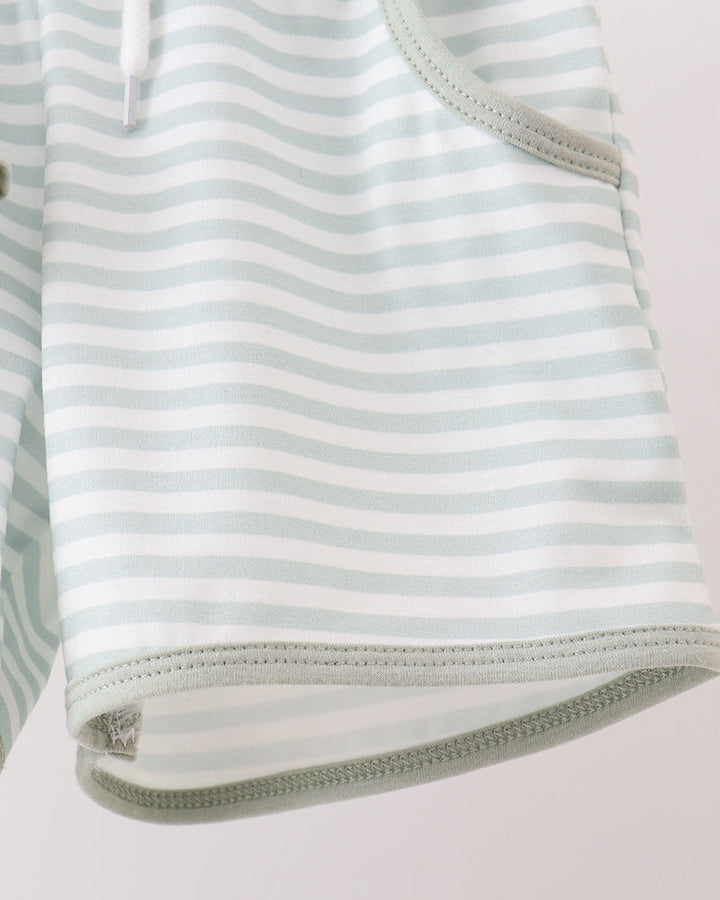 Striped outfit with a zipper on a light gray background