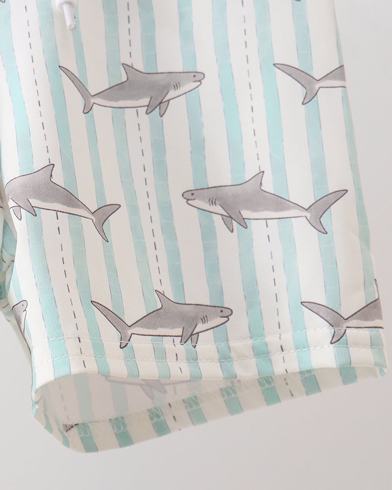 Fabric with shark pattern on striped background