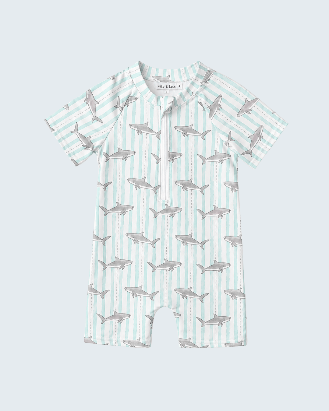 Baby swimsuit with shark pattern on a light blue background