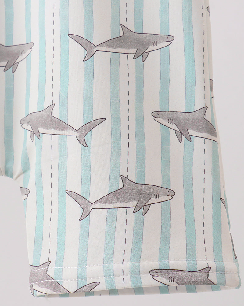 Fabric with shark pattern on a striped background