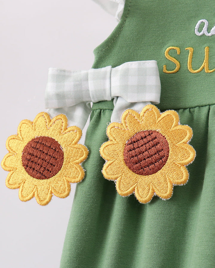 Green romper with two orange sunflower appliques and brown fabric centers