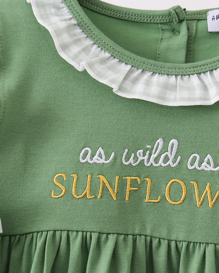 Green dress bodice with ruffled white gingham collar and embroidered sunflower text
