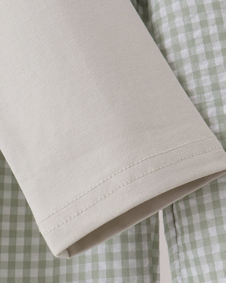 White long-sleeve shirt cuff with neat stitched hem