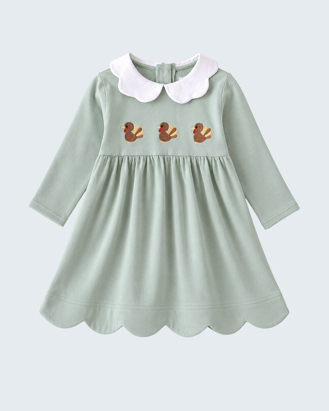 Green long-sleeve dress with white Peter Pan collar and turkey embroidery, scalloped hem
