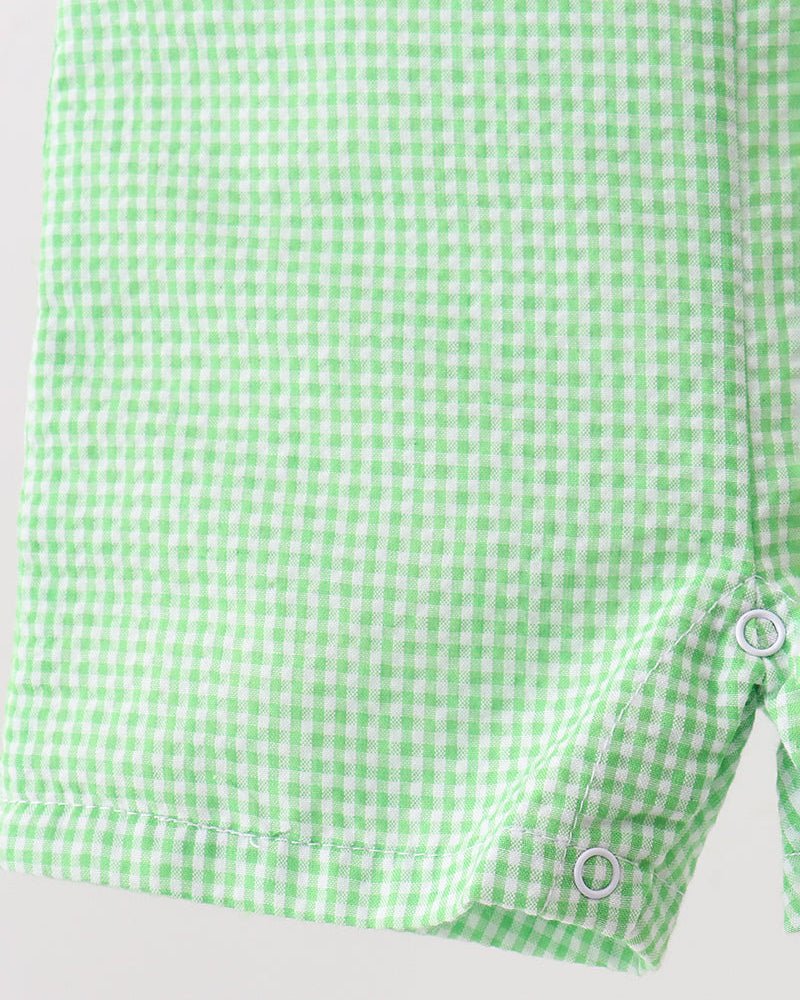 Green and white checkered shirt on a light gray background
