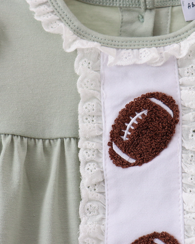 A close-up of a light sage green children&