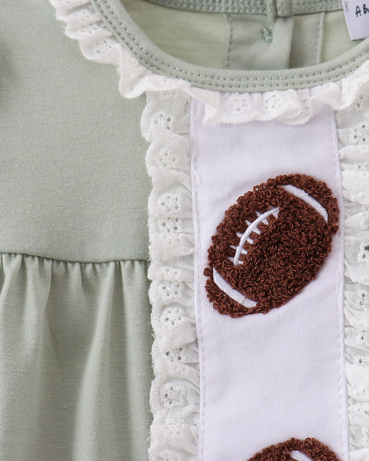 A close-up of a light sage green children&