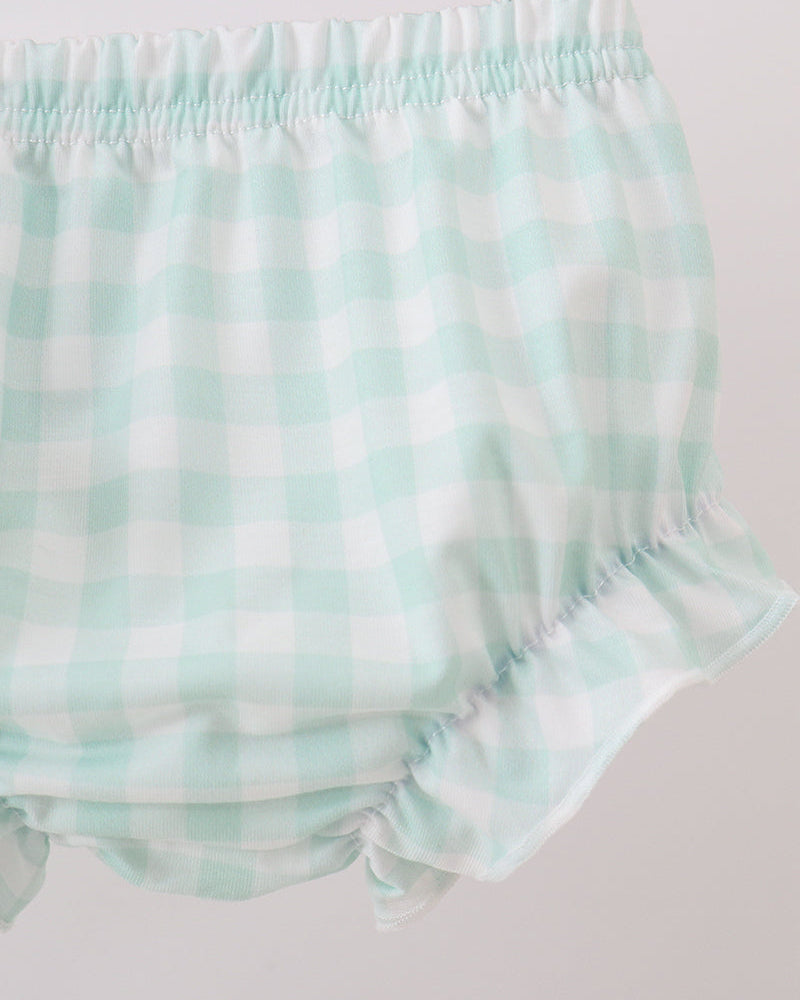 A close-up of a pair of baby bloomers in a mint green and white gingham check pattern, featuring an elastic waistband and ruffled leg openings.