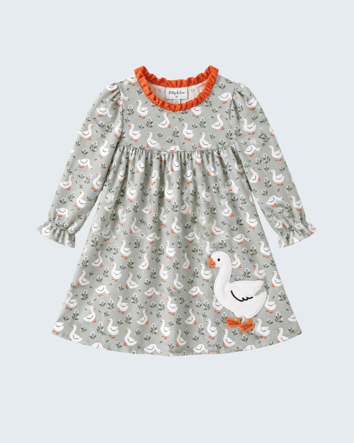 Light grey goose-print ruffle dress with orange trim and long puff sleeves