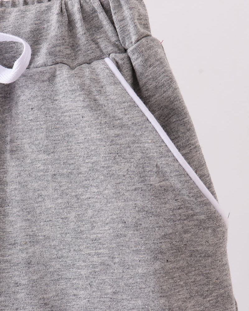 Grey skort detail: elastic waistband and white drawstring bow ties