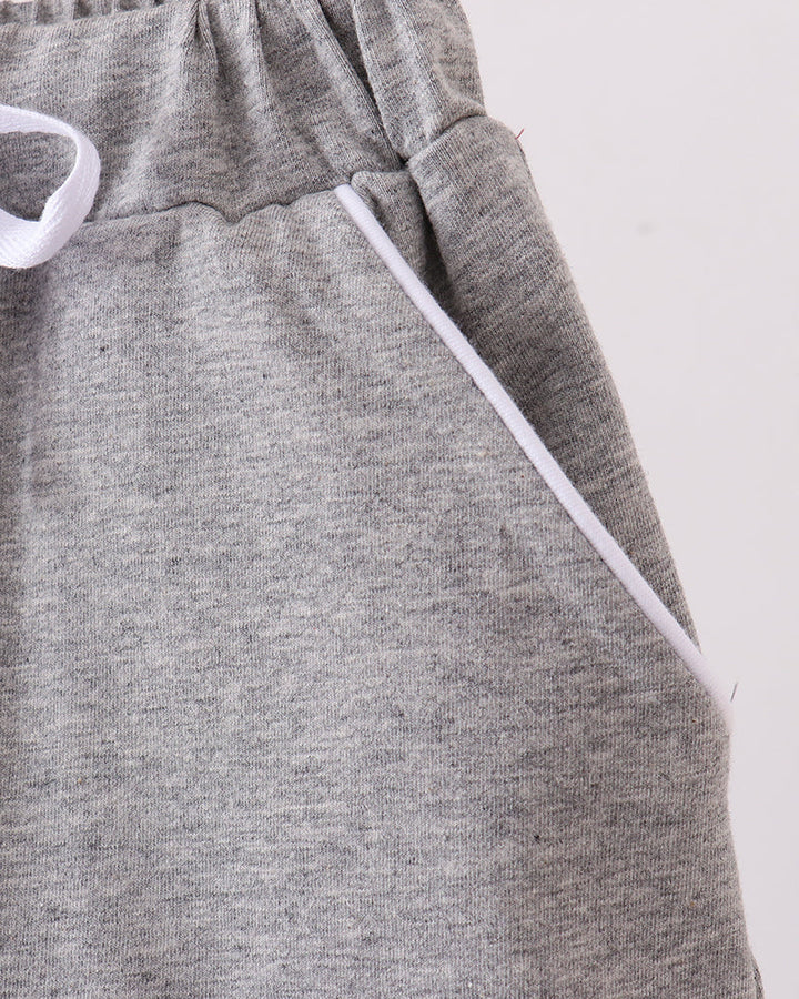 Grey skort detail: elastic waistband and white drawstring bow ties