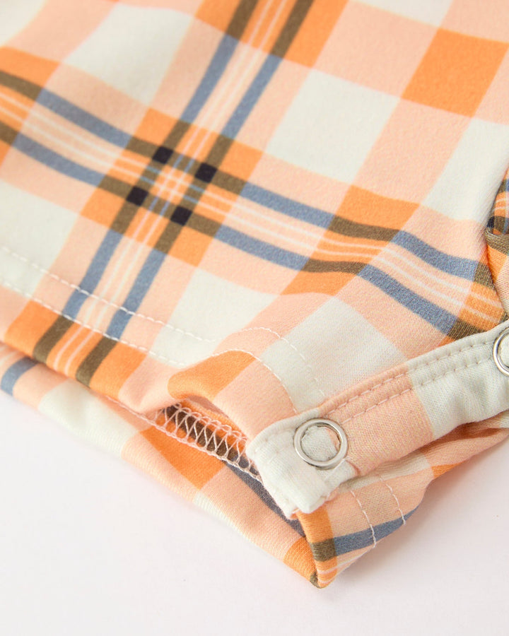 Plaid romper leg cuff with buttoned tab and stitched hem