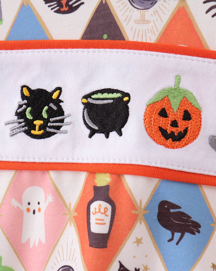 Kids romper waistband with embroidered cat face, cauldron, and jack-o&