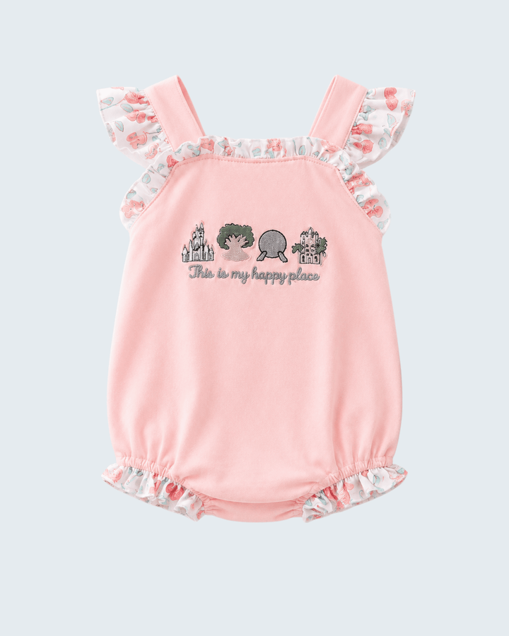 Pink baby romper with ruffled straps and text on a light gray background