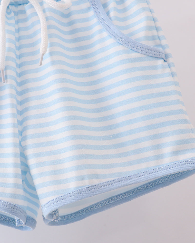 Blue and white striped shorts outfit on a light gray background
