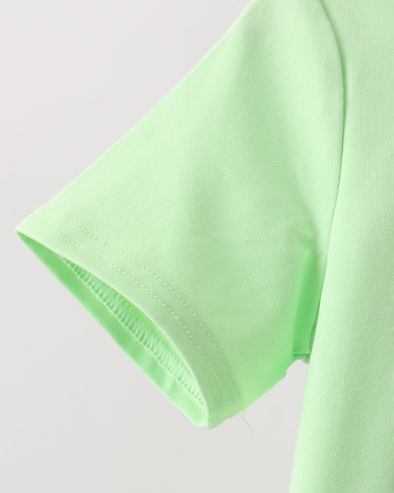 Lime green T-shirt sleeve with stitched trim detail
