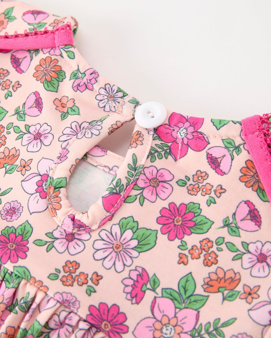 Floral girl dress back with hot pink neck button closure