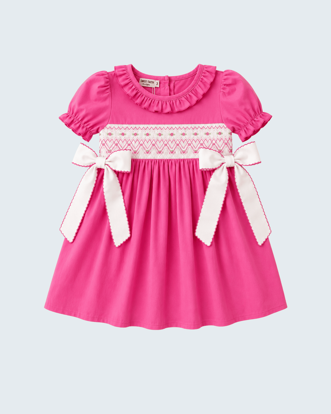 Hot pink smocked dress with white bow ties, ruffled short sleeves, gathered skirt