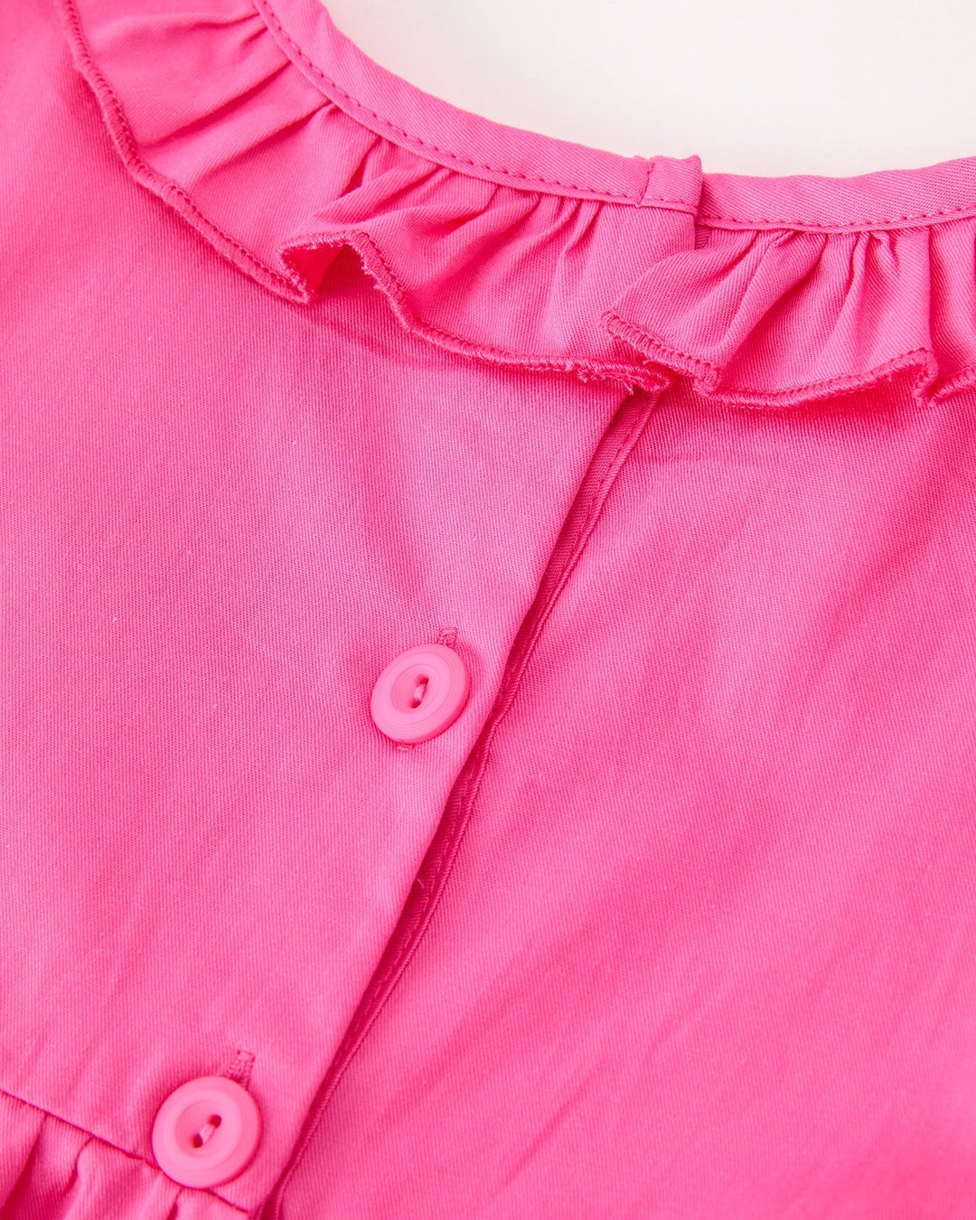 Girls hot pink dress with ruffled neckline and two-button front closure