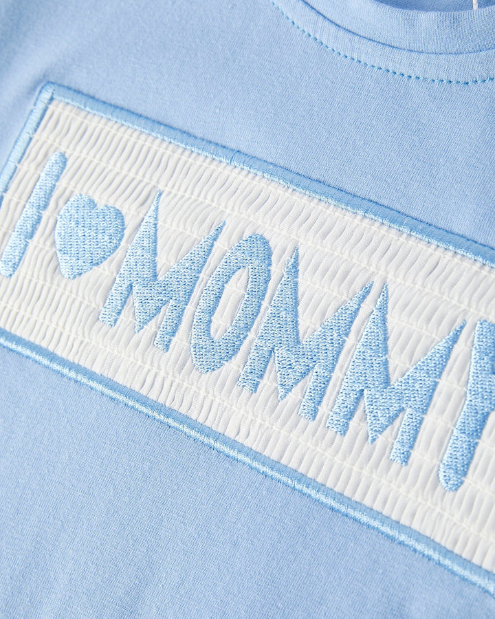 Light blue fabric with &