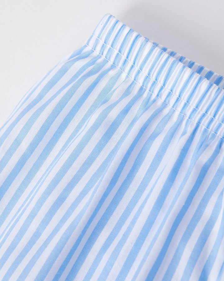 Close-up of a blue and white striped fabric with a plain background