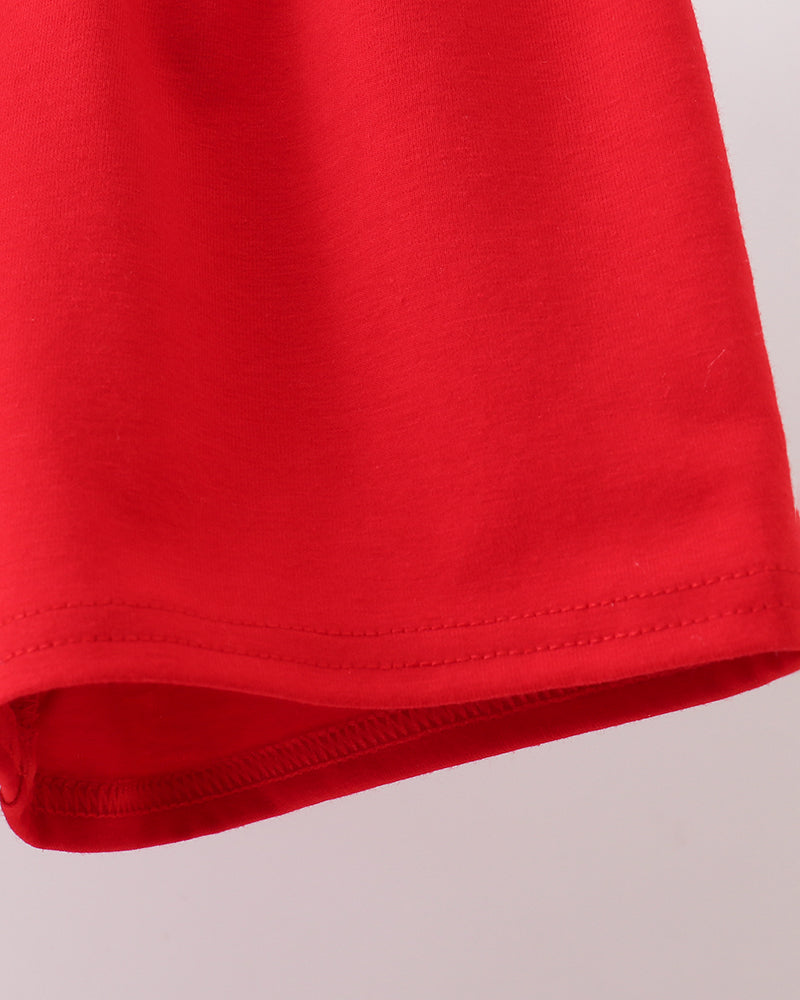 Close-up of a red fabric texture on a light gray background