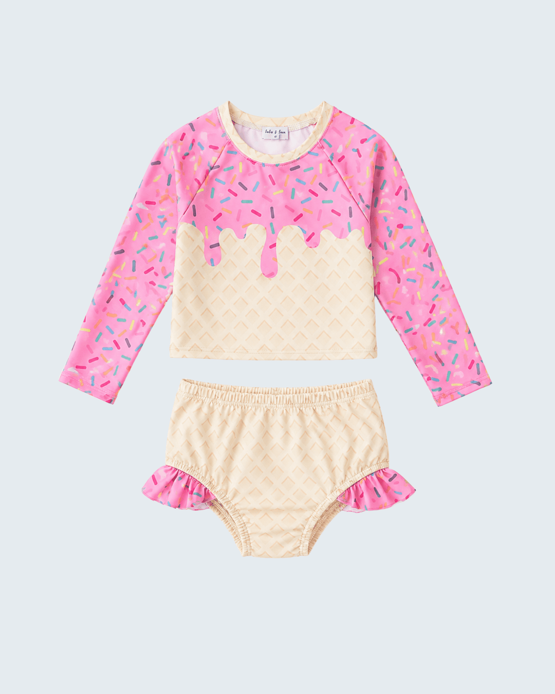 Children's two-piece swimsuit with pink and beige design on a light gray background