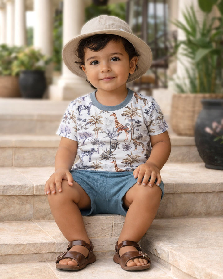 Young boy sitting on steps