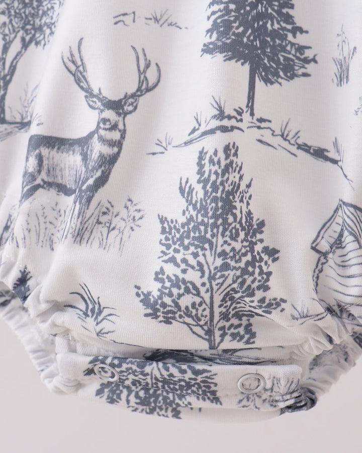 Blue deer and tree print bubble romper with elastic leg ruffle and side button