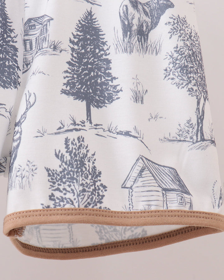 White shorts with blue forest print and tan cuff trim
