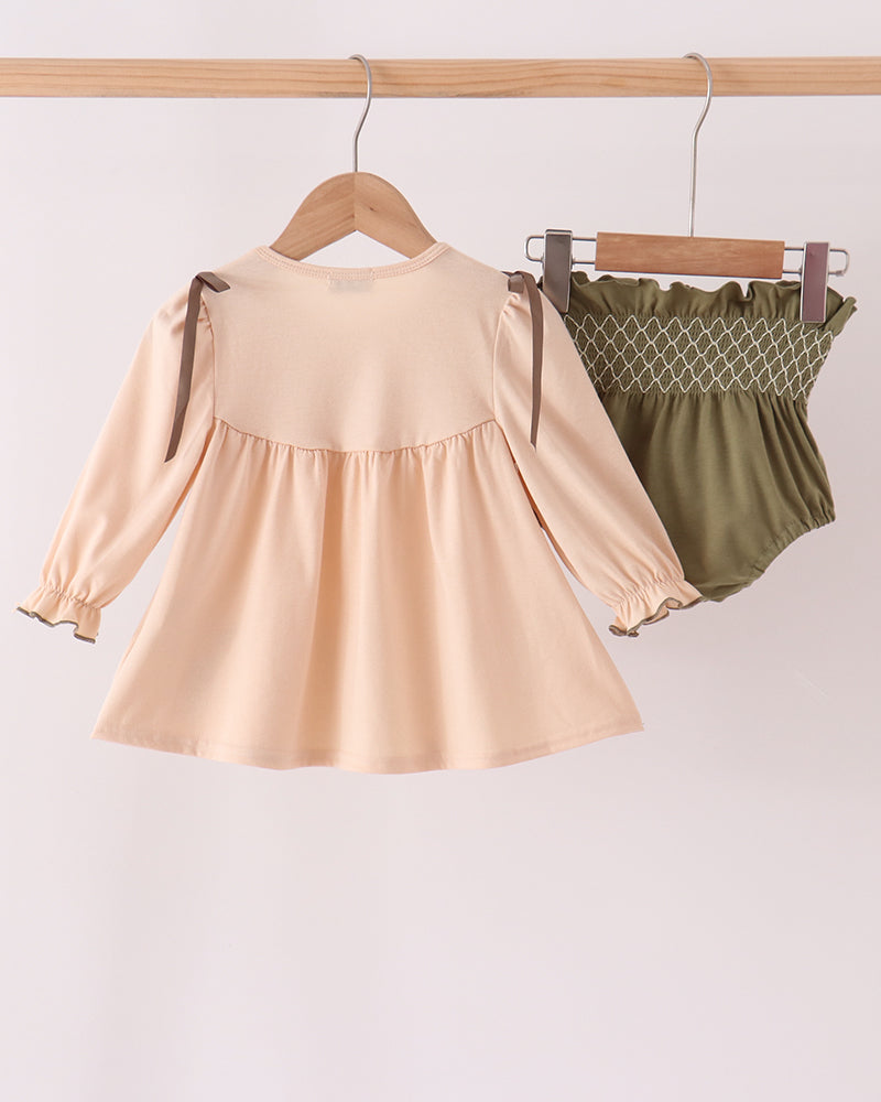 Khaki smocked dress and olive bloomers set on hangers