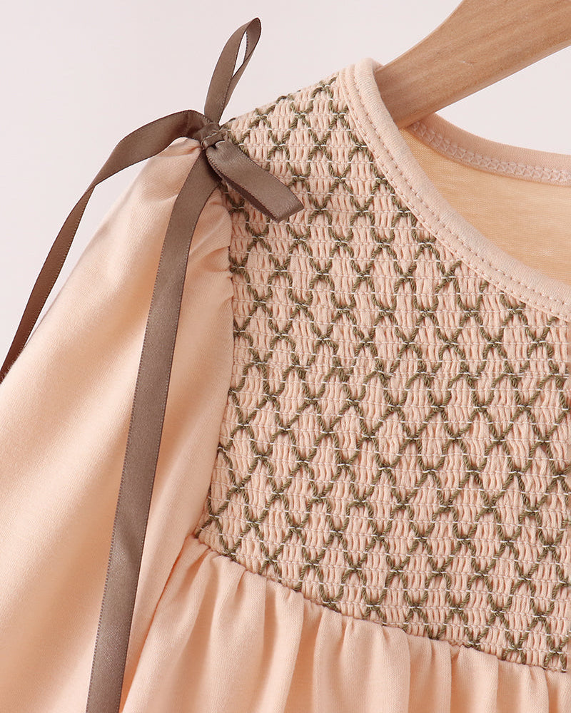 Beige smocked yoke dress with ribbon bow shoulder straps and long puff sleeves