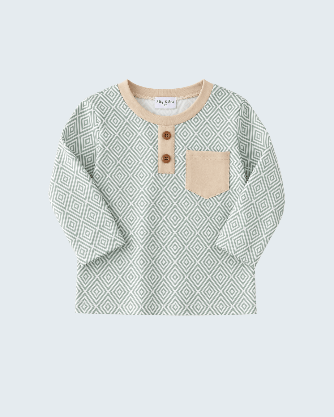 A baby long-sleeve henley shirt with a sage green and white geometric diamond pattern, featuring a beige ribbed collar, three brown buttons, and a matching beige chest pocket, shown on a light gray background.
