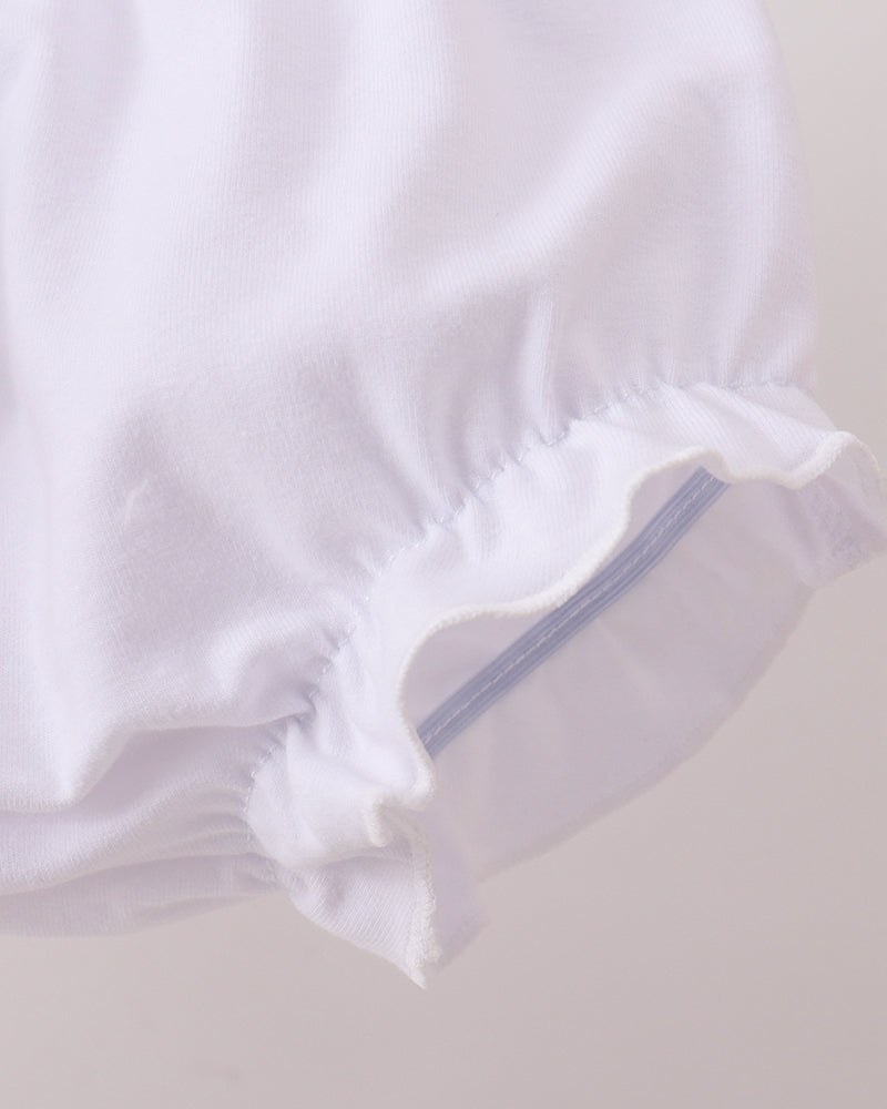 White baby bloomers with a zipper on a light gray background