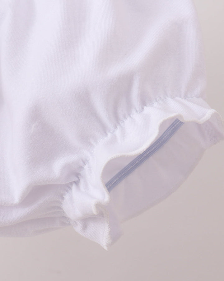 White baby bloomers with a zipper on a light gray background
