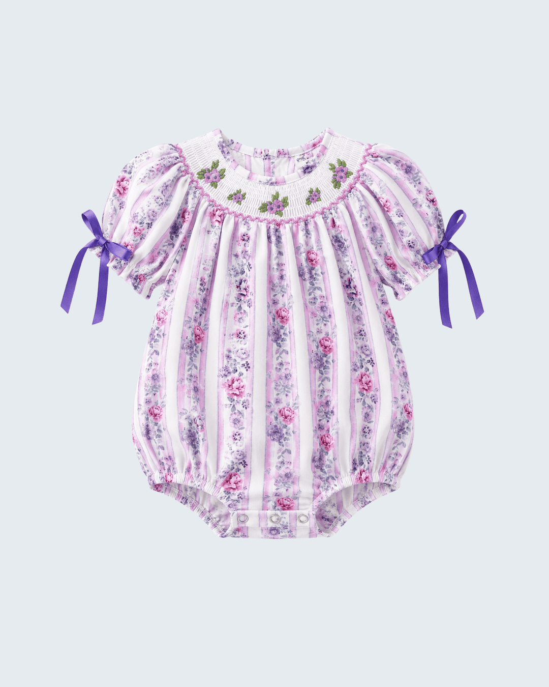 Lavender floral smocked baby romper with striped ruffle bodice and bow-tied sleeves