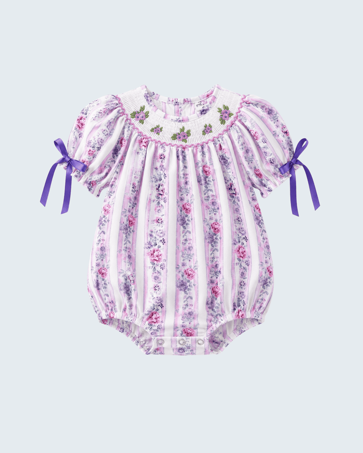 Lavender floral smocked baby romper with striped ruffle bodice and bow-tied sleeves