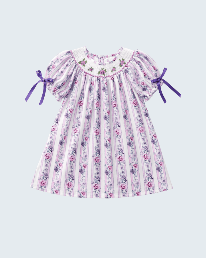Lavender floral smocked dress with striped print, flutter sleeves and ribbon bows