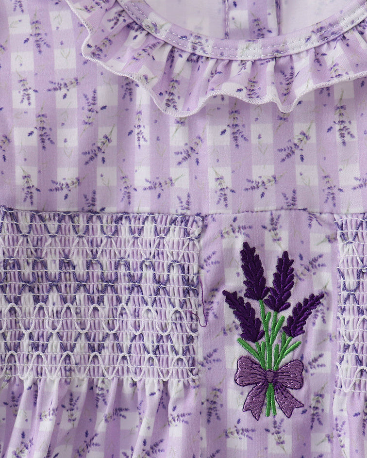 Lavender dress with floral patterns and embroidery on a white background