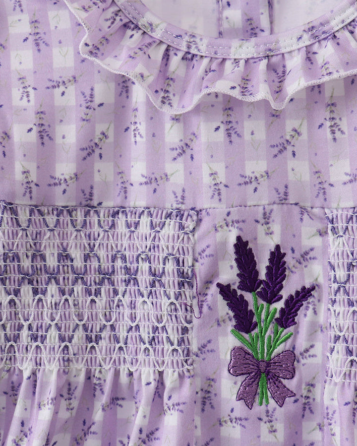 Lavender dress with floral patterns and embroidery on a white background