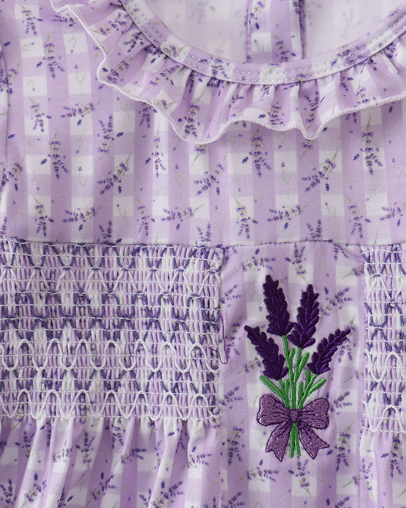 Lavender dress with floral patterns and embroidery on a white background