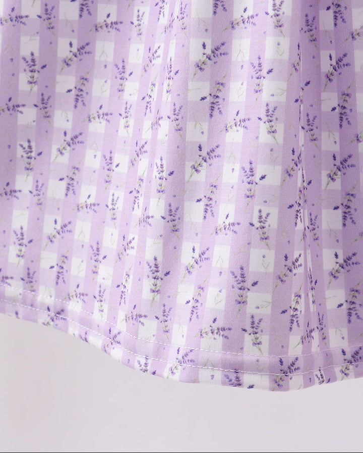 Lavender checkered fabric with floral pattern on a white background