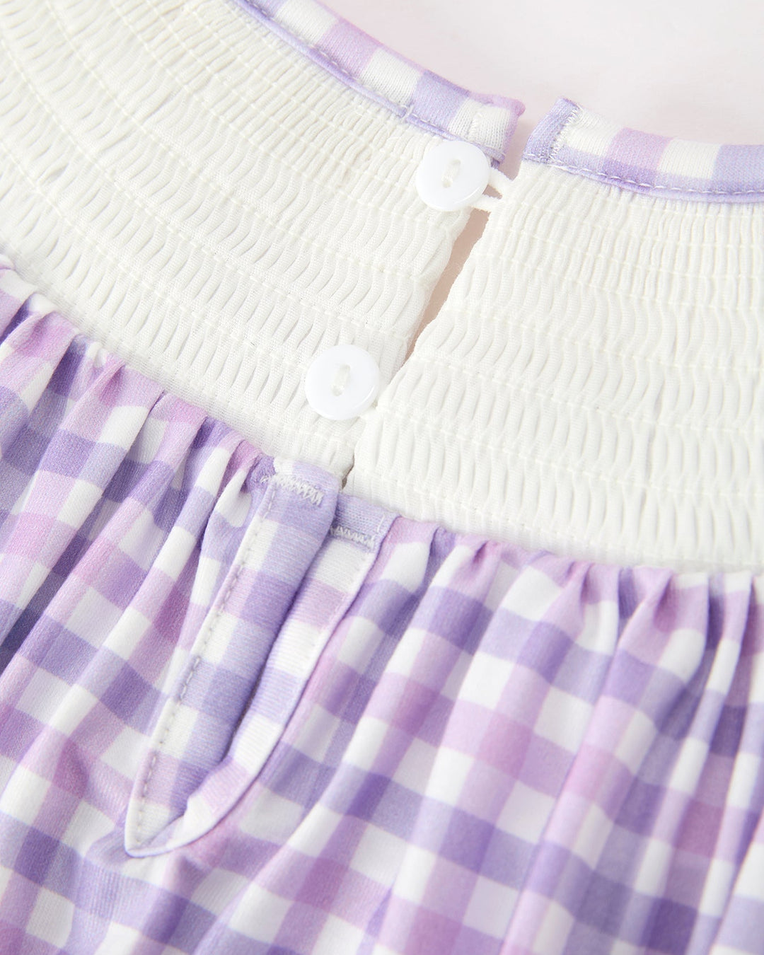 Girls lavender plaid dress with white button placket and smocked neckline
