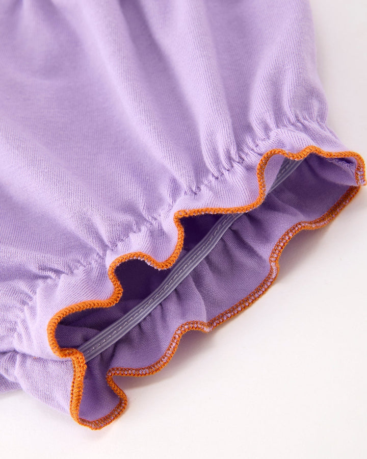 Lavender bloomers with gathered waistband and orange-edged ruffle trim