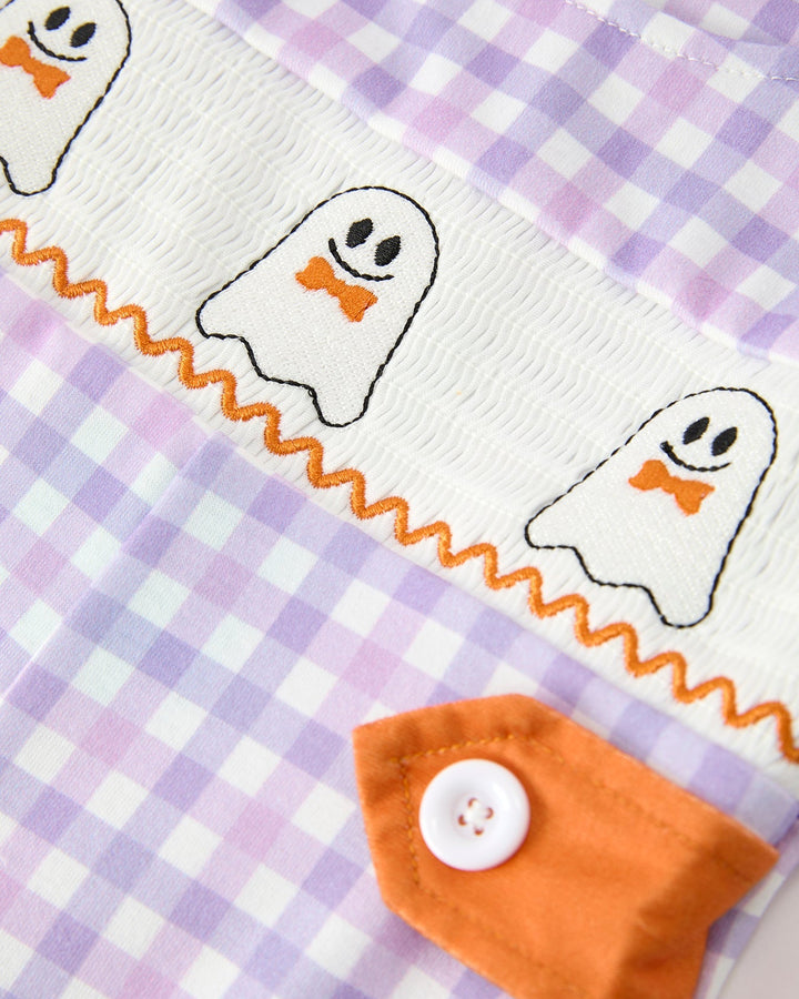 Baby boy romper front detail, stitched ghost faces on white trim with orange pocket