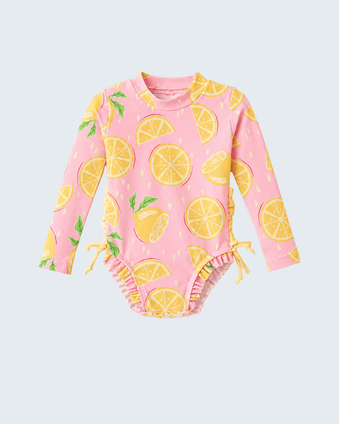 Pink baby swimsuit with lemon pattern on a light gray background