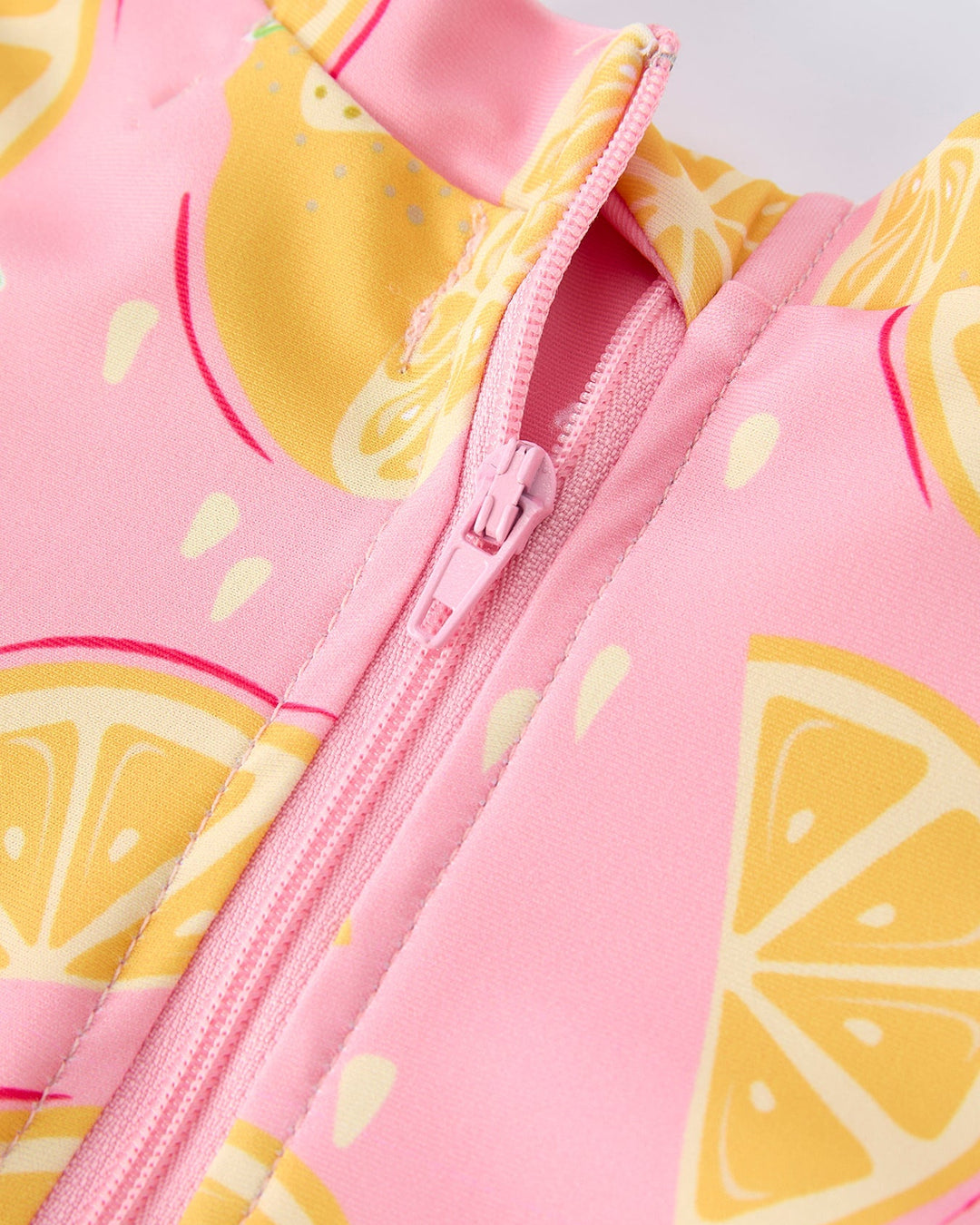 Pink swimsuit with lemon pattern and zipper
