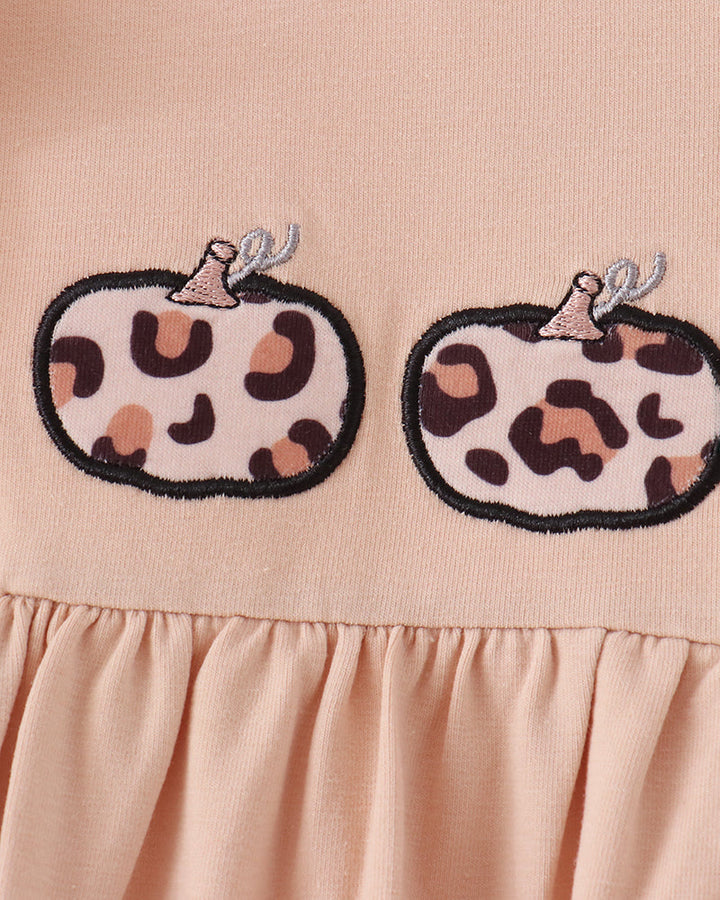Beige dress bodice with two stitched leopard pumpkin applique designs